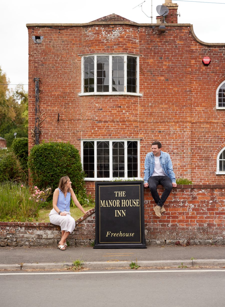 pub team members posing outside venue